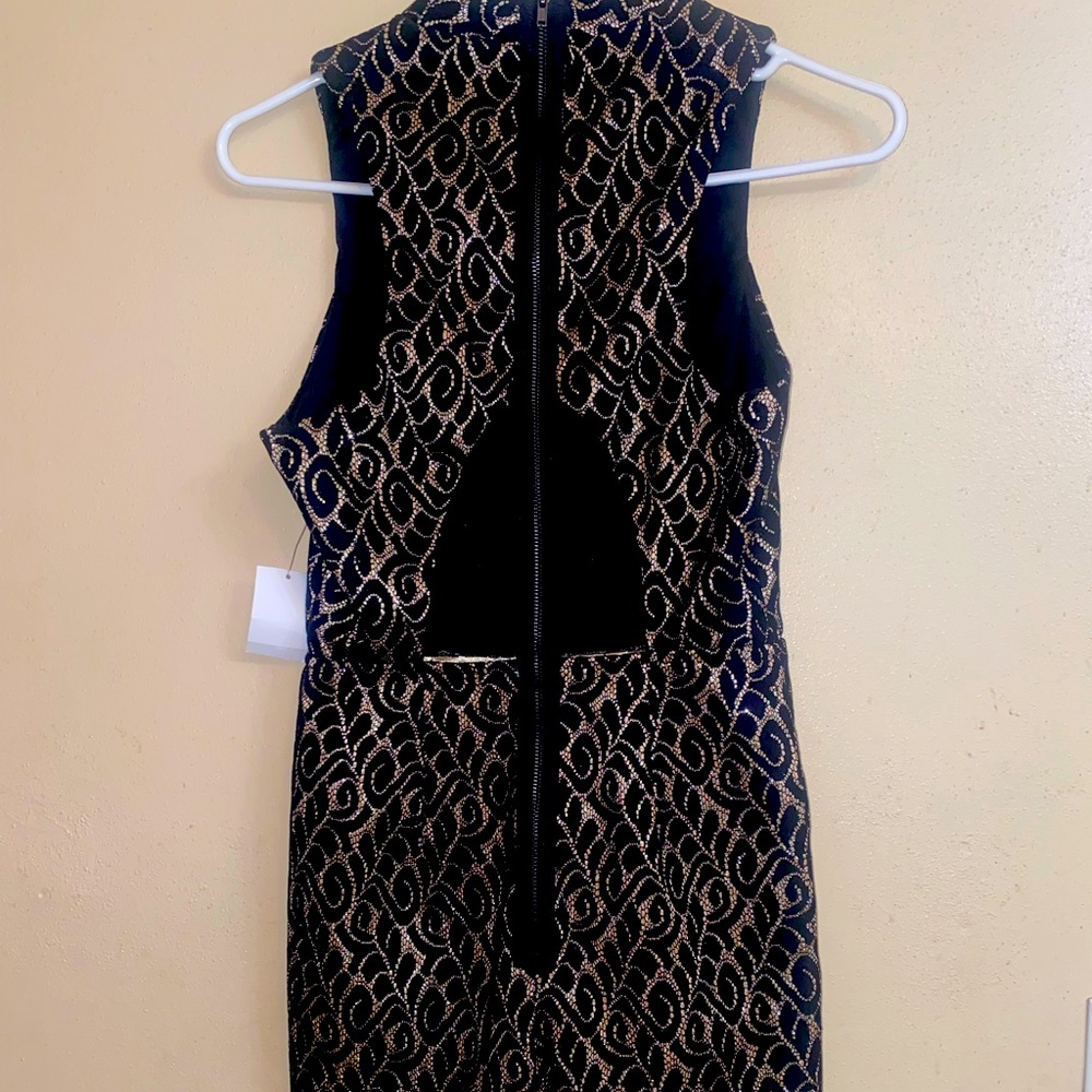 Sleeveless mock neck romper from Charlotte Russe. Black & gold glitter detail.